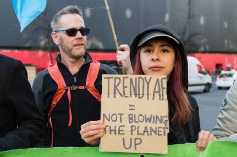 February 17, 2019 - London, Greater London, United Kingdom - Activists from Extinction Rebellion disrupt London Fashion Week by stopping traffic and creating gridlock between the event venues on 17 February, 2019. Protesters call for the British Fashion Council to influence fashion industry to stop the trend of excessive consumption and unsustainable growth in the face of climate change and ecological collapse. Textiles production contributes 1.2 billion tonnes of carbon emissions annually and textiles are the largest single source (34.8%) of microplastic pollution affecting marine life. London United Kingdom  - ZUMAn230 20190217_zaa_n230_208 Copyright: xWiktorxSzymanowiczx