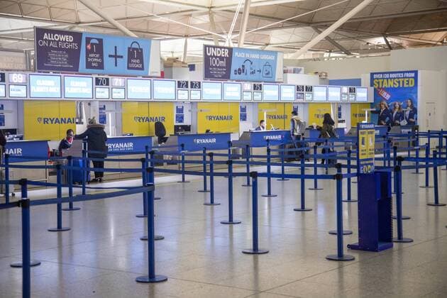 February 4, 2019 - London, United Kingdom - Check-in counters of RYANAIR low cost airline. Check in counter desks inside the main hall in the terminal of Stansted International airport in London, England, UK. London United Kingdom  - ZUMAn230 20190204_zaa_n230_674 Copyright: xNicolasxEconomoux