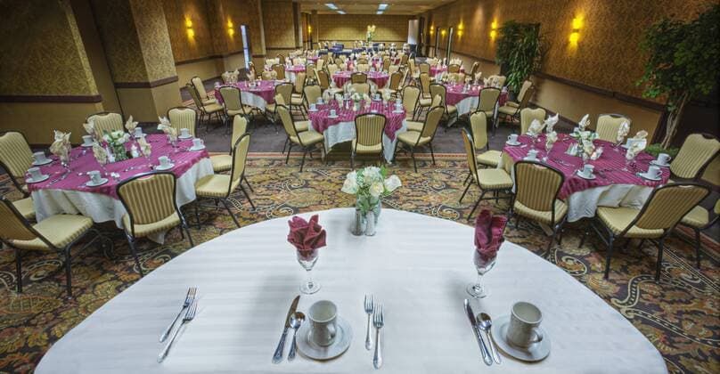 Place settings on tables in banquet room Place settings on tables in banquet room,Bellevue, Washington, USA  48118