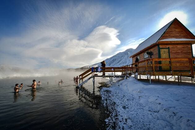 KAMCHATKA TERRITORY, RUSSIA - FEBRUARY 22, 2019: Tourists swim in the Khodutka (Khodutkinskiye) hot spring in South Kamchatka Nature Park on the Kamchatka Peninsula in Russia s Far East; South Kamchatka Nature Park was created in 1995 and included in the UNESCO World Cultural and Natural Heritage List under the name of Volcanoes of Kamchatka, in 1996. Yuri Smityuk TASS  TS0A1EE0