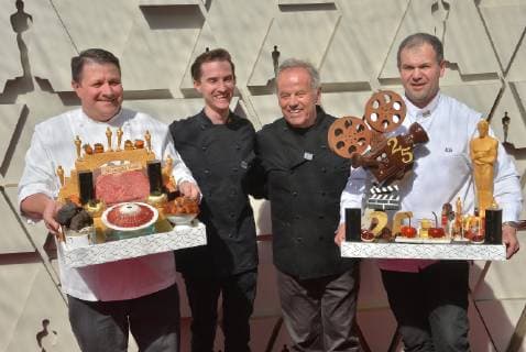 From left to right, Eric Klein, Byron Puck, Wolfgang Puck and Kamel Guechida arrive on the red carpet for the 91st annual Academy Awards at the Dolby Theatre in the Hollywood section of Los Angeles on February 24, 2019.  LAP20190224511 JIMxRUYMEN