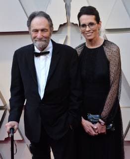 Eric Roth and guest arrive on the red carpet for the 91st annual Academy Awards at the Dolby Theatre in the Hollywood section of Los Angeles on February 24, 2019.  LAP20190224251 JIMxRUYMEN