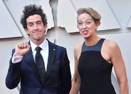 Robbie Ryan (L) and guest arrive on the red carpet for the 91st annual Academy Awards at the Dolby Theatre in the Hollywood section of Los Angeles on February 24, 2019.  LAP20190224274 JIMxRUYMEN