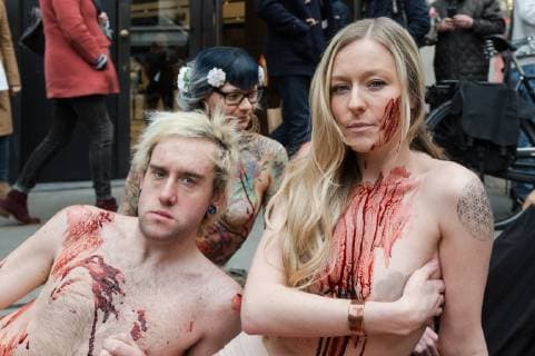 March 1, 2019 - London, Greater London, United Kingdom - Activists from People for the Ethical Treatment of Animals (PETA) lie nearly naked and covered with fake blood outside Canada Goose flagship store in London on 01 March, 2019, as they protest against use of coyote fur by the retailer and the cruel practices associated with its sourcing. London United Kingdom  - ZUMAn230 20190301_zaa_n230_360 Copyright: xWiktorxSzymanowiczx