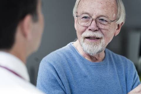 Senior patient talking to doctor in medical practice model released Symbolfoto property released  JOSF02788