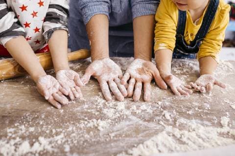 Mother and children with flour on their hands, partial view model released Symbolfoto property released  JRFF02343