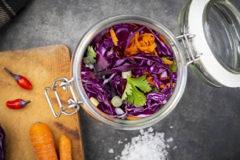 Homemade red cabbage, fermented, with chili, carrot and coriander, in a preserving jar  LVF07654