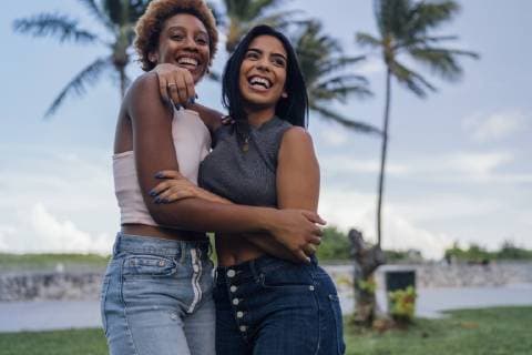 Two happy female friends hugging in a park model released Symbolfoto  BOYF01215