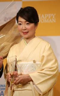 March 8, 2019, Tokyo, Japan - Japanese fashion magazine chief editor Hiromi Sogo holds the trophy as she receives the Happy Woman Award 2019 for SDGs on the International Women s Day in Tokyo on Friday, March 8, 2019. Five women were awarded as they contributed to the promotion of gender equality and UN s SDGs.  (98742900)
