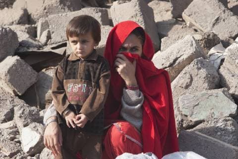 Woman And Boy By The Rubble Of A Building Destroyed By The 8 October 2005 Earthquake, Muzaffarabad, Azad Kashmir, Pakistan  Copyright: PeterxLanger 2087828