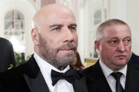 MOSCOW, RUSSIA â€“ MARCH 19, 2019: American actor John Travolta (L) ahead of a ceremony to present BraVo international classical music awards at the Bolshoi Theatre. Mikhail Japaridze TASS  TS0A51B9
