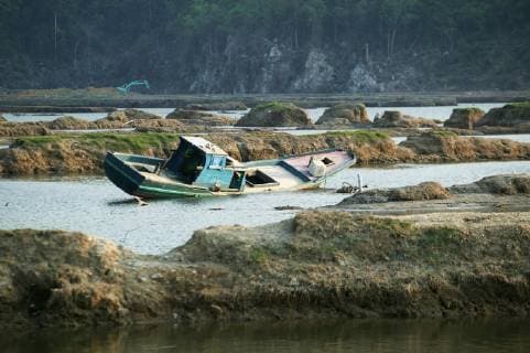 A Wrecked Fishing Boat In The Water After The Indian Ocean Earthquake And Tsunami Of 2004; Aceh Province, Indonesia  Copyright: JimxHolmes 2382669