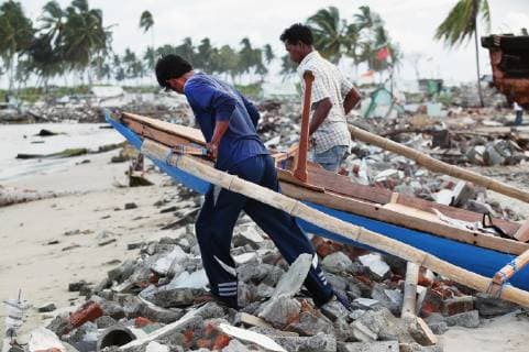 Fishermen Dragging A Small Fishing Boat To The Sea After The Indian Ocean Tsunami In 2004; Meulaboh, Aceh Province, Sumatra, Indonesia  Copyright: JimxHolmes 2382770