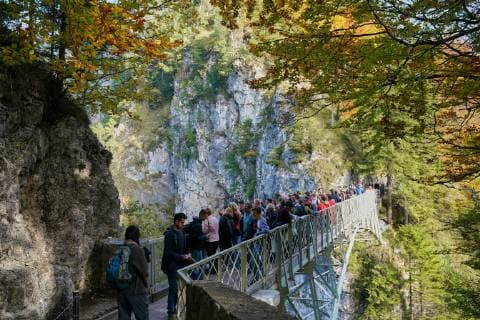 Neuschwanstein castle with Marienbrücke, bridge on October 9, 2018 in Hohenschwangau, Germany. Photographer: Peter Schatz