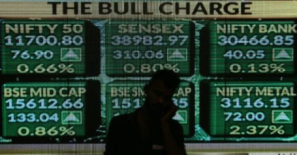 (190402) -- MUMBAI, April 2, 2019 (Xinhua) -- A man stands in front of the Bombay Stock Exchange (BSE) in Mumbai, India, April 1, 2019. India s benchmark 30-share equity index Sensex touched a record high of 39,000-mark for the first time on Monday on the expectation of easing global economic slowdown, revival in India s corporate earnings and a possible rate cut by the central bank later this week. (Xinhua Stringer) INDIA-MUMBAI-BOMBAY STOCK EXCHANGE 