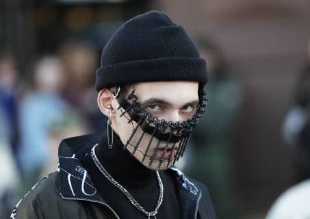 MOSCOW, RUSSIA - APRIL 3, 2019: A young man by the Manege Central Exhibition Hall that hosts the Mercedes-Benz Fashion Week Russia shows. Sergei Karpukhin TASS  TS0A6E2C