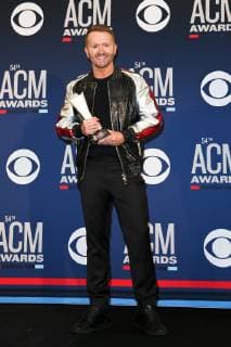 April 7, 2019 - Las Vegas, Nevada, United States - Shane McAnally holds the trophy for winning ACM Songwriter of the Year at the 54th Academy of Country Music Awards at MGM Grand Arena in Las Vegas, Nevada. Las Vegas United States - ZUMAw109 20190407_zap_w109_071 Copyright: xDebbyxWongx