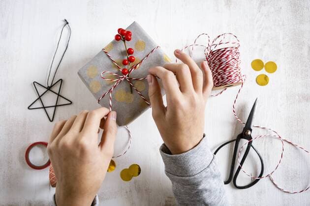 Girl s hands wrapping Christmas present model released Symbolfoto  OJF00325