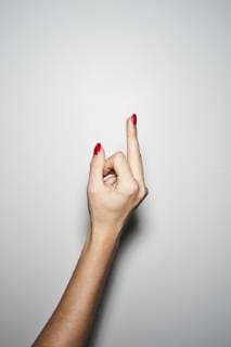 Close-up of woman giving the finger model released Symbolfoto property released  PNEF01302
