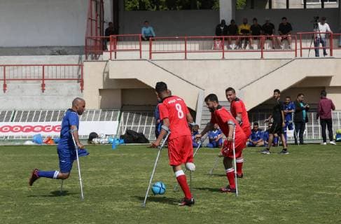 April 13, 2019 - Gaza City, Gaza Strip, Palestinian Territory - Palestinian amputees using crutches play a football match during the first football tournament for amputees, at Palestine Stadium in Gaza city, on April 13, 2019. More than 125 have had amputations shot by Israeli forces during a year of weekly mass protests along the Gaza border, according to Palestinian figures Gaza City Palestinian Territory - ZUMAap3_ 20190413_zaf_ap3_056 Copyright: xAshrafxAmrax