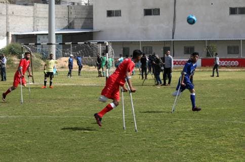 April 13, 2019 - Gaza City, Gaza Strip, Palestinian Territory - Palestinian amputees using crutches play a football match during the first football tournament for amputees, at Palestine Stadium in Gaza city, on April 13, 2019. More than 125 have had amputations shot by Israeli forces during a year of weekly mass protests along the Gaza border, according to Palestinian figures Gaza City Palestinian Territory - ZUMAap3_ 20190413_zaf_ap3_048 Copyright: xAshrafxAmrax