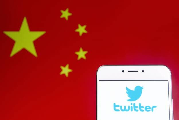 April 6, 2019 - Hong Kong - In this photo illustration a American online news and social networking service Twitter logo is seen on an Android mobile device with People s Republic of China flag in the background. Hong Kong - ZUMAs197 20190406_zab_s197_249 Copyright: xBudrulxChukrutx