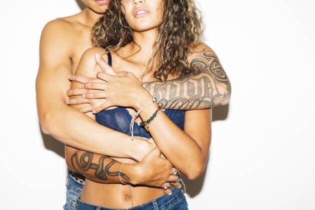 Young man passionately embracing girlfriend model released Symbolfoto  MRAF00350