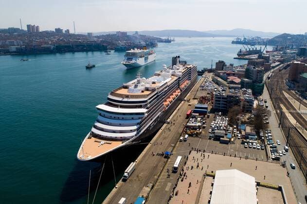 VLADIVOSTOK, RUSSIA - APRIL 22, 2019: The Westerdam cruise ship (front) operated by Holland America Line and the Costa NeoRomantica cruise ship (L back) operated by Costa Crociere in the port of Vladivostok on Russia s Pacific coast. Yuri Smityuk TASS  TS0A91A9