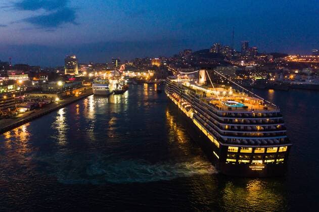 VLADIVOSTOK, RUSSIA - APRIL 22, 2019: The Westerdam cruise ship (R) operated by Holland America Line leaving the port of Vladivostok on Russia s Pacific coast. Yuri Smityuk TASS  TS0A9233