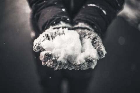 Close-up of hands with gloves catching snow model released Symbolfoto  ACPF00462