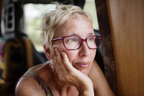 France, portrait of pensive woman in camper model released Symbolfoto property released  JATF01128
