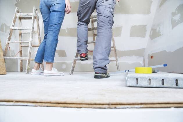 Legs of couple with ladder in attic to be renovated model released Symbolfoto property released  MFRF01201