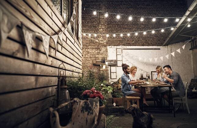 Friends having a barbecue in the backyard, eating together model released Symbolfoto property released  PDF01882