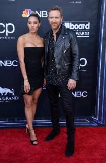 (L-R) Jessica Ledon and David Guetta arrive for the 2019 Billboard Music Awards at the MGM Grand Garden Arena in Las Vegas, Nevada on May 1, 2019.  LAV20190501415 JIMxRUYMEN