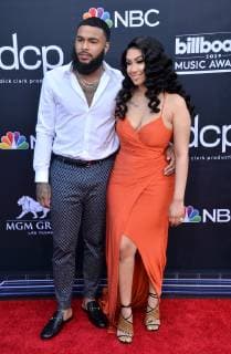 (L-R) Clarence White and Queen Naija arrive for the 2019 Billboard Music Awards at the MGM Grand Garden Arena in Las Vegas, Nevada on May 1, 2019.  LAV20190501442 JIMxRUYMEN