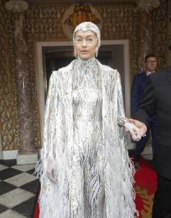 USA: Met Gala celebrities at The Pierre Hotel Gigi Hadid wearing gown by Michael Kors leaves The Pierre Hotel for Met Gala on theme Camp: Notes on Fashion New York New York United States Lev Radin  LevxRadin