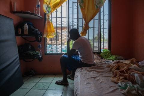 Stephen sits in his motel room who he shares with 2 other men to keep the cost down in Tapachula, Mexico on May 8, 2019. Stephen traveled from his home country, Cameroon to Mexico in hopes of getting an exit visa so he can travel to the US-Mexico border and seek asylum.  TP2019050811 ARIANAxDREHSLER