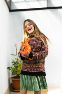 Portrait of happy girl playing with dinosaur toy at home model released Symbolfoto property released  ERRF00970