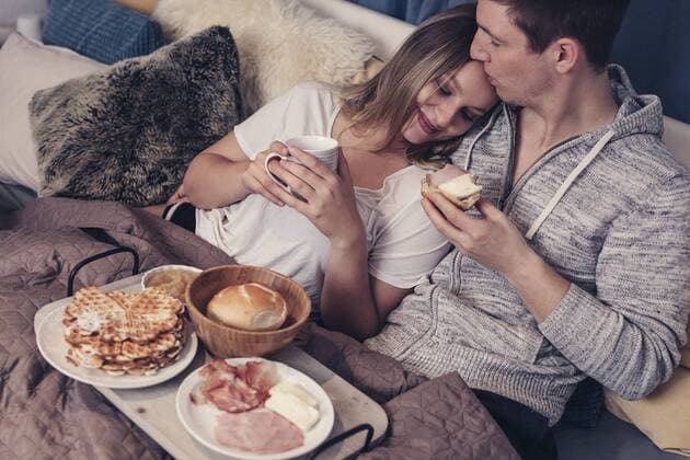 Young couple having breakfast in bed model released Symbolfoto property released  SEBF00079