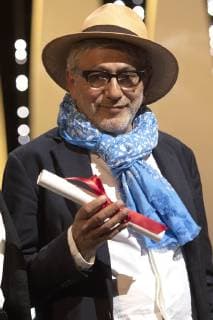 Elia Suleiman accepts the Special Mention Prize for It Must Be Heaven at the award ceremony during the 72nd Cannes Film Festival at the Palais des Festivals on May 25, 2019 in Cannes, France