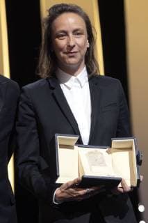Celine Sciamma accepts the Best Screenplay Award for the movie Portrait Of A Lady On Fire at the award ceremony during the 72nd Cannes Film Festival at the Palais des Festivals on May 25, 2019 in Cannes, France