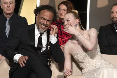Alejandro Gonzalez Inarritu and Elle Fanning at the award ceremony during the 72nd Cannes Film Festival at the Palais des Festivals on May 25, 2019 in Cannes, France