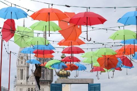 Coloured umbrellas at festival - Zagreb, Croatia 30.05.2019., Zagreb, Croatia - Hanging coroured umbrellas as a part of preparation for Bas Nas gourmet & music festival at upper town in Zagreb  PatrikxMacek PIXSELL