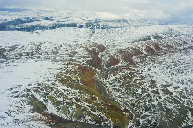 CANADA Aerial view of tundra landscape with light covering of snow, Ellesmere Island, Nunavut, Canada, June 2008. Taken on location for the BBC series, Frozen Planet.  1356845 JeffxWilson