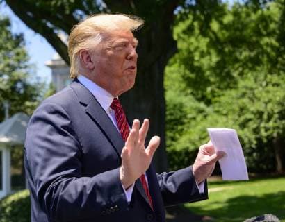 June 11, 2019 - Washington, District of Columbia, U.S. - United States President Donald J. Trump shows what he says is a page of the agreement with Mexico as he takes questions from reporters as he prepares to depart the South Lawn of the White House in Washington, DC for a trip to Iowa. He will return this evening Washington U.S. - ZUMAs152 20190611_zaa_s152_001 Copyright: xRonxSachsx