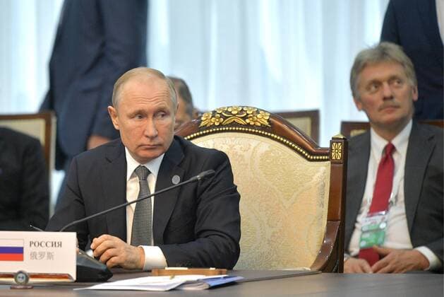 BISHKEK, KYRGYZSTAN - JUNE 14, 2019: Russia s President Vladimir Putin (L) and his spokesman Dmitry Peskov at a meeting of the Shanghai Cooperation Organisation (SCO) Council of Heads of State. Alexei Druzhinin Russian Presidential Press and Information Office TASS  TS0AF837
