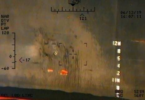 June 13, 2019 - Gilf of Oman - Imagery taken from a U.S. Navy MH-60R helicopter of the Islamic Revolutionary Guard Corps Navy of the remnants of the magnetic attachment device of unexploded limpet mine from the M T Kokuka Courageous Gilf of Oman - ZUMAz03_ 20190613_sha_z03_287 Copyright: xDoDx