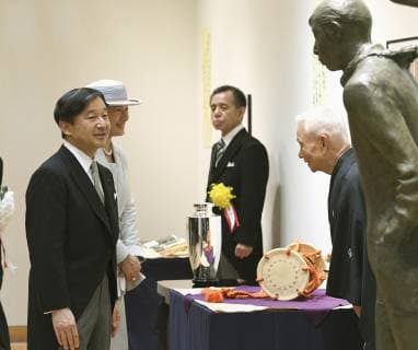 Japan emperor, empress at award ceremony Japan s Emperor Naruhito (L) and Empress Masako talk with Tadao Kamei, a drummer for Noh plays, as he wins the Japan Art Academy award in Tokyo on June 24, 2019. (Pool photo) 