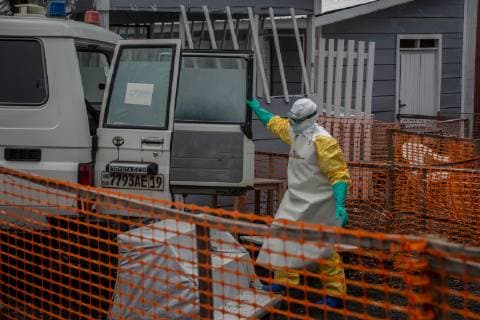 June 15, 2019 - Goma, North Kivu, Democratic Republic of Congo - A health worker dressed in a full protective outfit stands next to an ambulance at an Ebola treatment centre in Goma..DR Congo is currently experiencing the second worst Ebola outbreak in recorded history. More than 1,400 people have died. Goma Democratic Republic of Congo - ZUMAs197 20190615_zab_s197_053 Copyright: xSallyxHaydenx