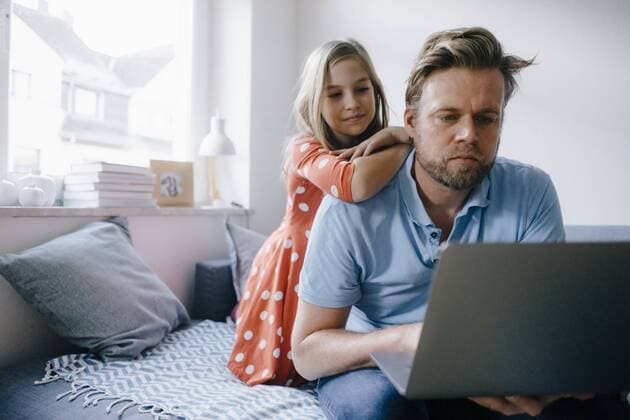 Girl watching father using laptop at home model released Symbolfoto property released  KNSF05884